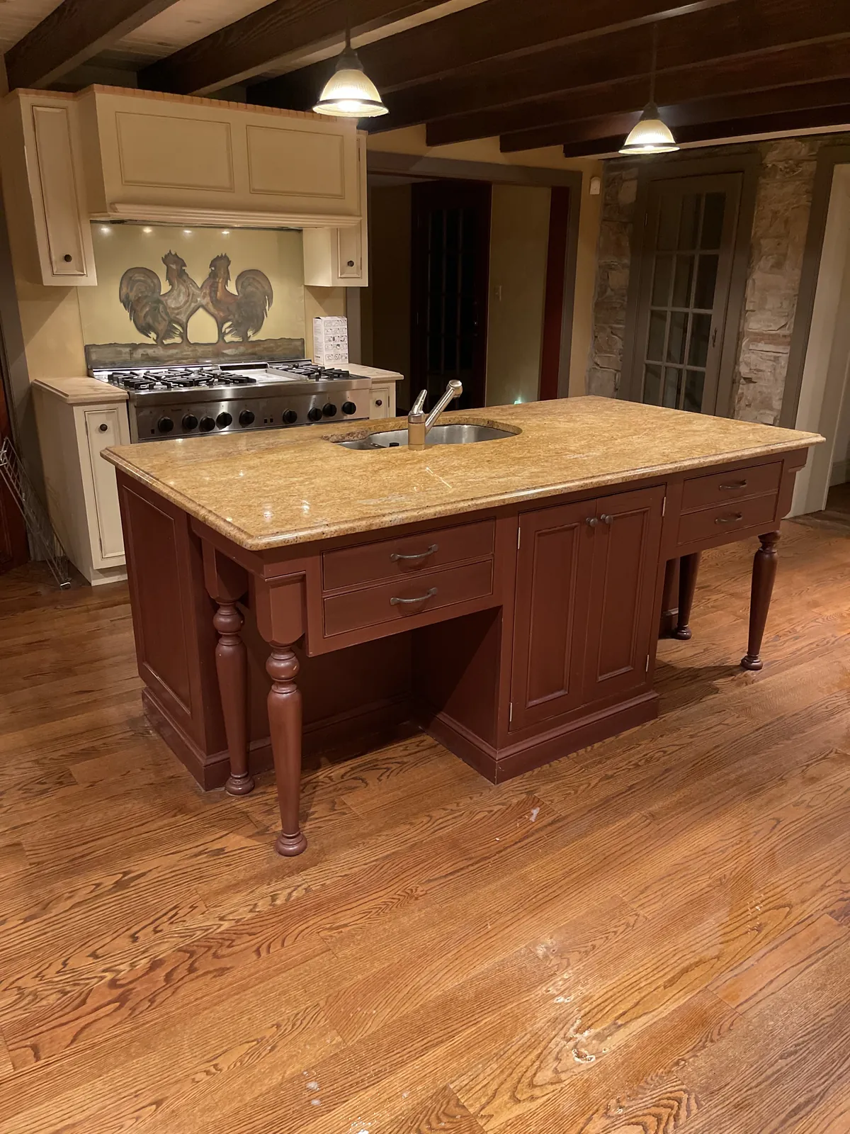 Traditional kitchen with a center island and wood cabinetry